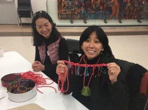 Following only a simple prompt, "String it!," this educator created a unique jewelry design out of the materials at her table during Tandem's break-out session.