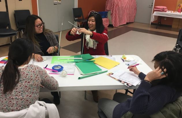 As I observed these educators playing with the paper and straws, I wasn’t sure their structure would stay standing. By the time I got back around to their table again, they had fully succeeded in making it stand erect!